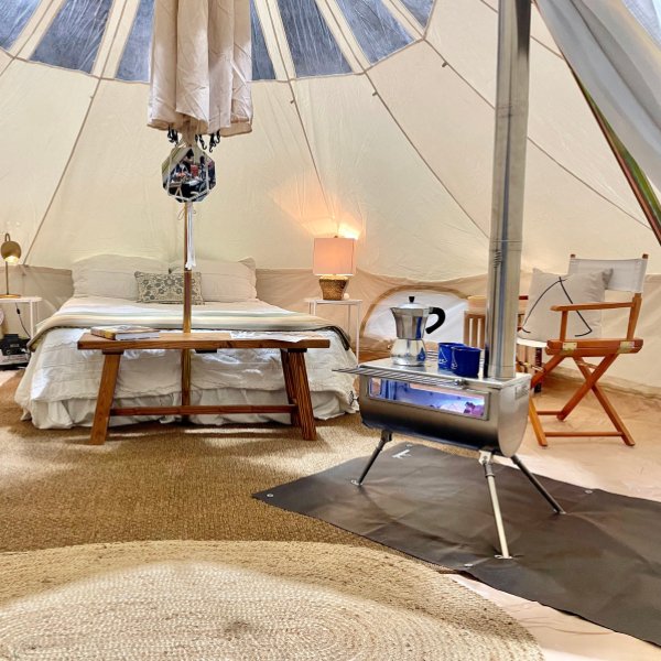 interior of tent with furniture and stove