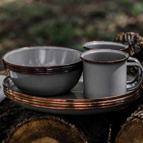 camping dinnerware dishes stacked outdoors